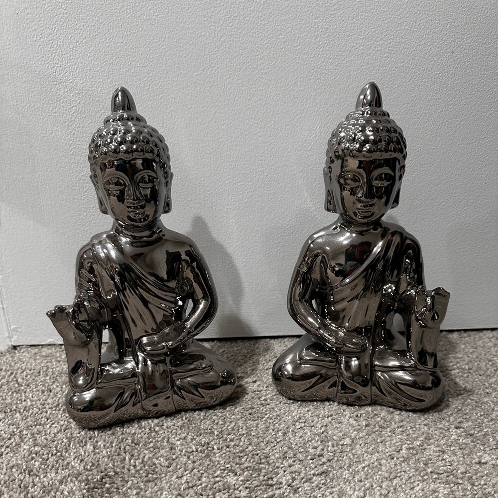 Pier 1 Bright silver tone and heavy sitting Buddha in excellent condition.